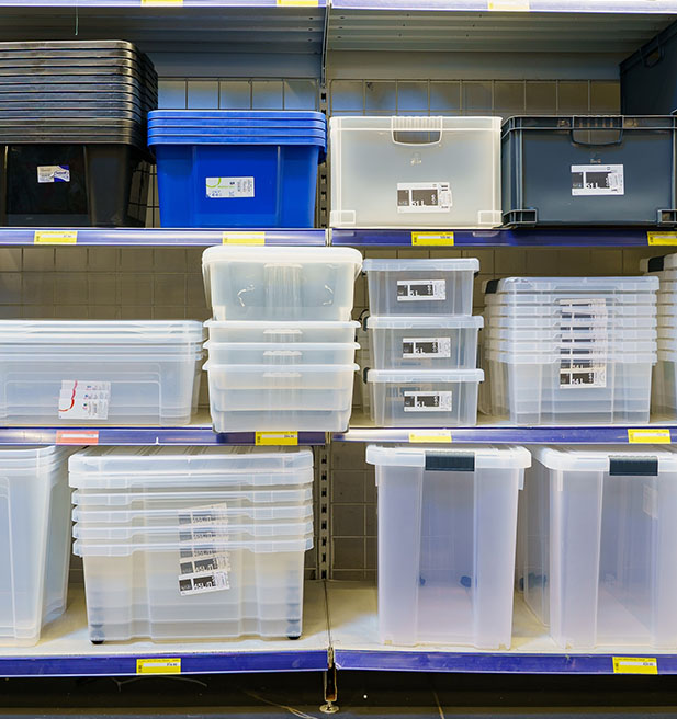 Clear storage containers stacked on a store shelf